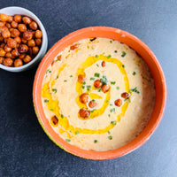 Creamy Cauliflower Soup with Chickpeas CroutonsIndulge in a comforting and savory meal with our Creamy Cauliflower Soup with Chickpeas Croutons. Bursting with robust flavors and a creamy vegetable broth, this vegan soup is a healthy and quick option. Enjoy the taste of cheesy goodness in every spoonful with the added benefits of nutrition and satisfaction.