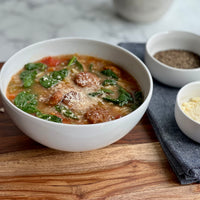 Greens, Beans, and Orzo Soup: Simple, rustic, hearty soup is full of flavor, and is a great easy meal to make. Herby plant based Italian meatballs, creamy white beans, orzo and healthy greens cooked in savory tomato broth is absolutely perfect any day.