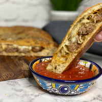 Stuffed Focaccia: Simple, Italian inspired meal  has all the flavors of your favorite pizza. Golden, warm, yeasty  bread stuffed with plant based savory  sausage and cheese, served with a side of a robust sweet marinara sauce makes easy, fun party dinner.